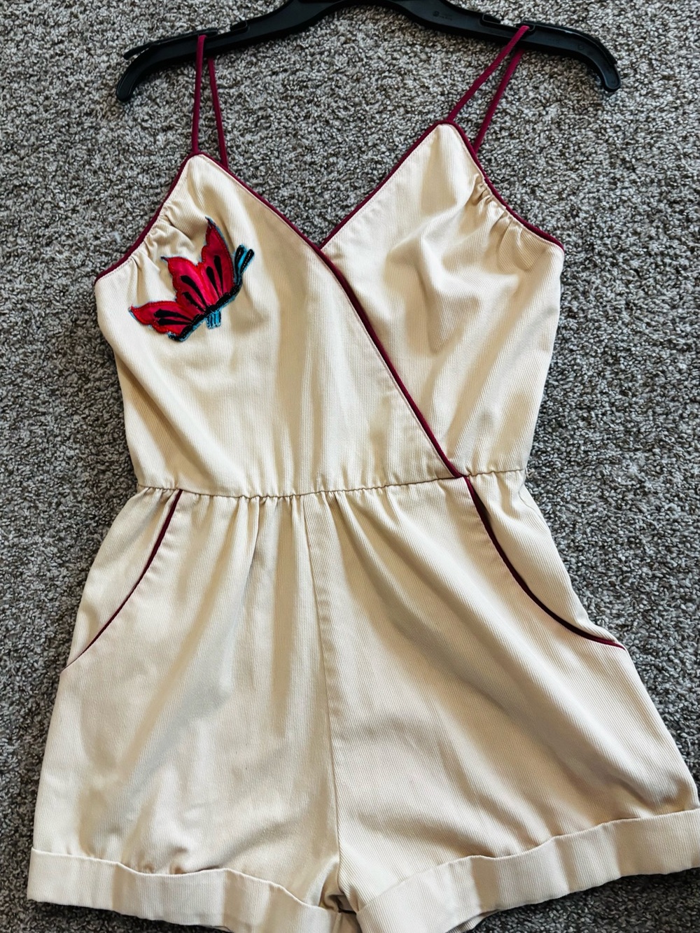 Cream Romper with Red Butterfly Accent